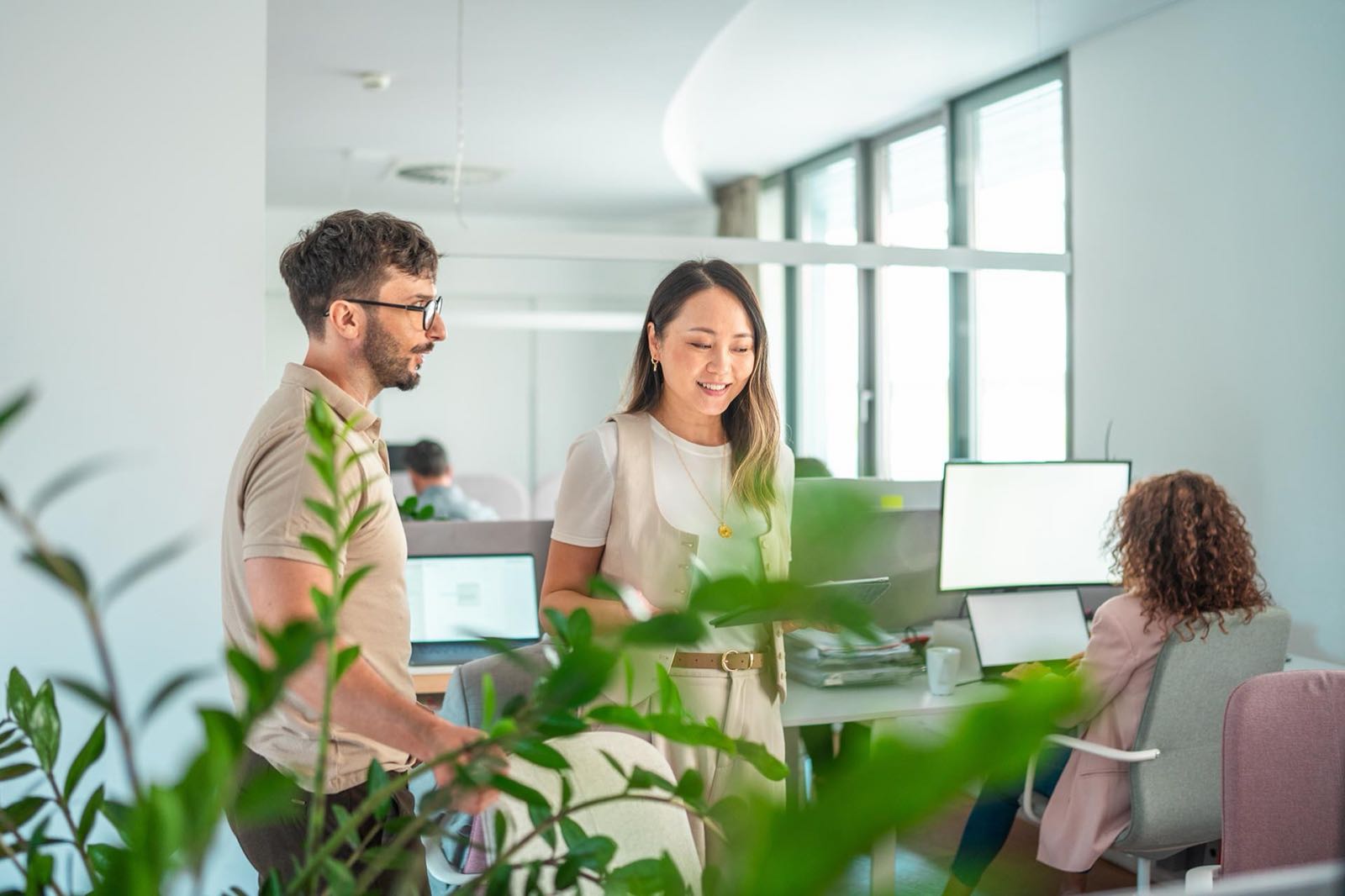 Colleagues discussing HR in a bright office